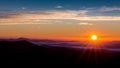 Sun peaks over the mountain peaks of the Blue Ridge Parkway Royalty Free Stock Photo