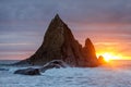 Sun peeking through stormy clouds at Martins Beach