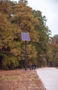 Sun Power Street Light in autumn city park Royalty Free Stock Photo