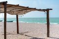 Sun protection roof on a mexican sandy beach to enjoy the hot sun - you can see turquoise crystal clear sea water