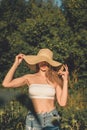 Sun Protection, sunscreen , UV protection, Time Outside and Stay Sun-safe. Young woman with straw hat protects from sun Royalty Free Stock Photo