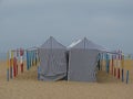 sun protection tents on the sand of the bathing beach in the town of NazarÃ©