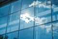 Sun ray and blue sky reflection on window office building, Business concept