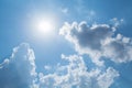 Sun rays against a blue sky in the clouds. Royalty Free Stock Photo