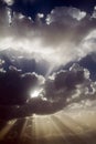 Sun rays behind clouds Royalty Free Stock Photo