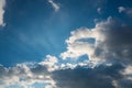 Sun rays behind dark clouds Royalty Free Stock Photo