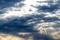 Sun rays breaking through cumulus clouds. The concept of divine light, a glimmer of hope or overcoming difficulties. Spiritual