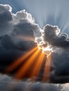 Sun rays breaking through storm clouds in a dramatic sky. Royalty Free Stock Photo