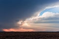 Sun rays shining through storm clouds Royalty Free Stock Photo