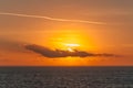 Sun rays color clouds during sunset on the Adriatic coast