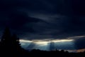 Sun rays coming out of storm clouds Royalty Free Stock Photo