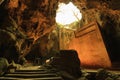 Sun rays fall into the cave with a big staircase