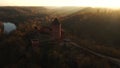 Sun rays fall onto Turaida castle during sunset aerial view