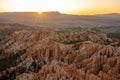 Sun Rays Flare Over Edge of Distant Mesa and Bryce Canyon Royalty Free Stock Photo