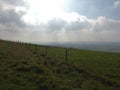 Sun rays on a misty morning across the hills Royalty Free Stock Photo