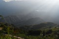 Sun rays over valley with rice terraces and fields Royalty Free Stock Photo