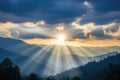 sun rays peeking through a dense cloud cover