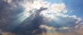 Sun Rays Push Through A Dense Cumulus Clouds