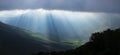 Sun rays seep through the clouds in the Pyrenees