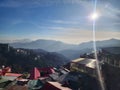 Sun rays shining bright over the hill houses in shimla in himachal pradesh