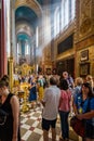 Sun rays shining in through church window on worshippers praying in the Russioan Orthodox Cathedral in Tallinn, Estonia