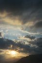 Sun rays shining through clouds Royalty Free Stock Photo