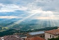 Sun rays shining down on hills