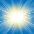 Sun rays. Starburst bright effect, isolated on blue background. Gold light star flash. Abstract shine beams. Vibrant Royalty Free Stock Photo