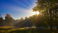 Sun rays sunrise trees Royalty Free Stock Photo