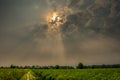 Sun rays at sunrise in a village farms