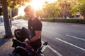 Sun reflect on young urban rider. Man prepares to ride a motorcycle in the city Royalty Free Stock Photo