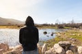 Sun reflected in the water of the marsh with silhouette of a person with his back to the foreground Royalty Free Stock Photo