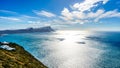 Sun reflecting of the waters of False Bay with Swartkopberg near Simons Town in the distant