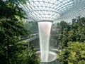 The sun reflects off the waterfall in the heart of the changi singapore airport jewel terminal 4