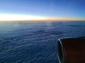 Sun rise from above the cloud from window seat of airplane Royalty Free Stock Photo