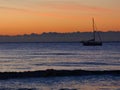 Sun Rise In Alicante With Yacht Sailing Past. Royalty Free Stock Photo