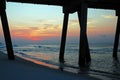 The sun rise, as seen from under the pier Royalty Free Stock Photo