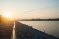 Sun rise on Mekong river with mountain and cloudy sky.