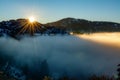 Sun rise over a valley filled with inversion fog Royalty Free Stock Photo