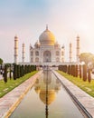 Sun rise at Taj Mahal front view reflected on the reflection pool.