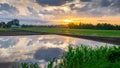 Sun rise with water reflection clouds. Royalty Free Stock Photo