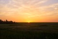 Sun rises above horizon in Russian countryside. Royalty Free Stock Photo