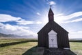 Sun rises behind Budakirkja church on a beautiful morning on Snaefellsnes Peninsula, Iceland