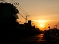 Sun Rises behind The City Streets Royalty Free Stock Photo