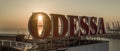 Sun rises behind large Odessa Sign Ukraine Royalty Free Stock Photo