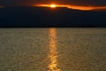 The Dead Sea at dawn and the first ray of sun that rises over the Jordanian mountains. Royalty Free Stock Photo