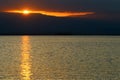 The Dead Sea at dawn and the first ray of sun that rises over the Jordanian mountains. Royalty Free Stock Photo