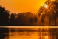 The Sun Rises over Gray`s Lake in Des Moines, Iowa