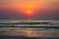 Sun rises over serene morning sea at Cha Am Beach