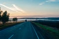 Sun Rising Above Asphalt Open Road In Sunny Sunrise Morning